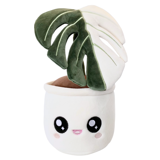 Plush toy of a potted plant with a white pot and a cute open-mouthed smiling face on the pot. The plant is a single leaf of a Monstera deliciosa albo variegata, featuring a split color pattern. The left half of the leaf is green, while the right half is white.